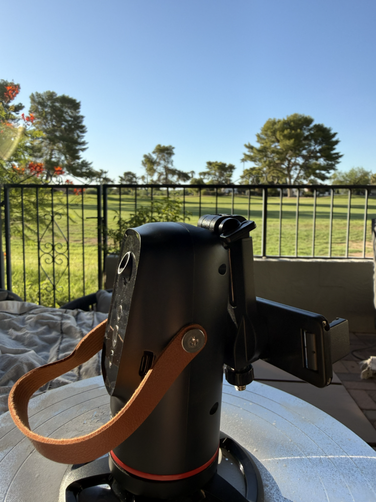 XO-SS20 auto face-tracking phone mount on a tabletop outdoors